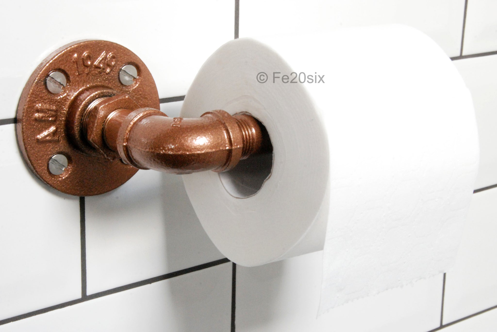 Copper coloured outlet toilet roll holder